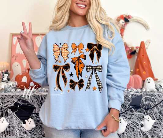 Orange and Black Spooky Bows on Light Blue